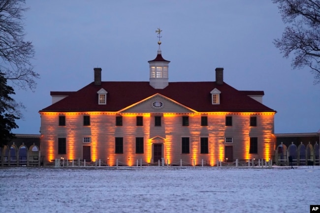 FILE - George Washington's residence is illuminated as President Joe Biden and first lady Jill Biden attend a dinner with members of the National Governors Association in Mount Vernon, Va., Jan. 30, 2022.