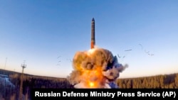 FILE - In this photo from the Russian Defense Ministry Press Service, on Dec. 9, 2020, a ground-based intercontinental ballistic missile was launched in northwestern Russia