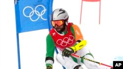Mohammad Arif Khan of India passes a gate during the second run of the men's giant slalom at the 2022 Winter Olympics, in the Yanqing district of Beijing, Feb. 13, 2022. 