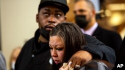 Daunte Wright's parents, Aubrey Wright and Katie Wright, react after former Brooklyn Center, Minnesota White police officer Kim Potter was sentenced to two years in prison for both first and second-degree manslaughter, Feb. 18, 2022 in Minneapolis. 