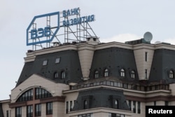 FILE - The logo of Russia's state development bank Vnesheconombank (VEB) is seen on top of a building in central Moscow, Russia, April 22, 2016.