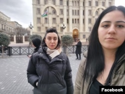 Journalists Sevinj Sadygova, left, and Fatima Movlamli are seen in a photo posted Feb. 15, 2022, on Movlamli's Facebook page.