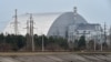 FILE - A giant protective dome built over the destroyed fourth reactor of the Chernobyl Nuclear Power Plant is seen April 13, 2021.