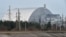 FILE - A giant protective dome built over the destroyed fourth reactor of the Chernobyl Nuclear Power Plant is seen April 13, 2021.