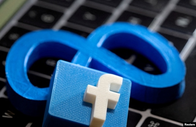 FILE - 3D-printed images of logos of Facebook parent Meta Platforms and of Facebook are seen on a laptop keyboard in this illustration taken on November 2, 2021. (REUTERS/Dado Ruvic/Illustration)