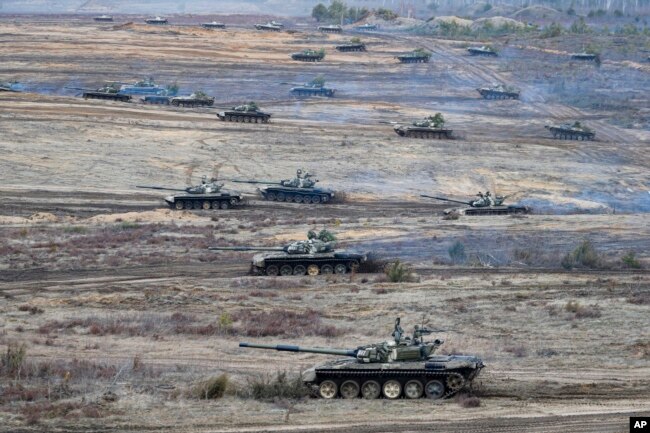 Tanks move during the Union Courage-2022 Russia-Belarus military drills at the Obuz-Lesnovsky training ground in Belarus, Feb. 19, 2022.
