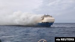 FILE - The ship, Felicity Ace burns more than 100 km from the Azores islands, Portugal, Feb. 18, 2022. (Portuguese navy handout via Reuters)