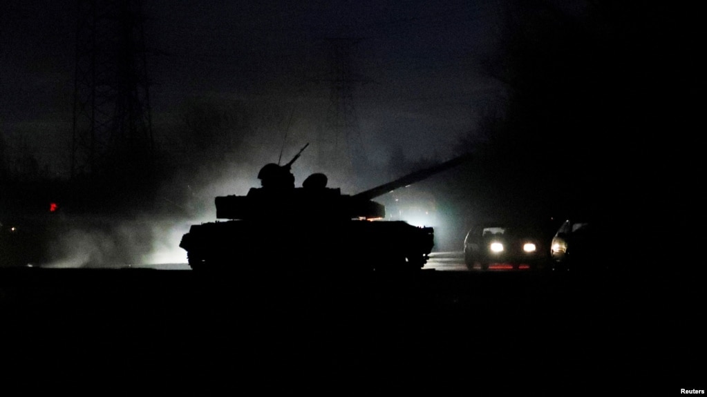 A tank drives along a street in the separatist-controlled city of Donetsk, Ukraine Feb. 22, 2022, after Russian President Vladimir Putin ordered the deployment of Russian troops to two breakaway regions in eastern Ukraine following the recognition of thei