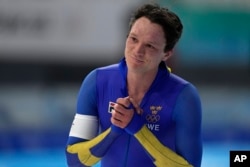 FILE- Nils van der Poel of Sweden reacts after breaking his own world record in the men's speedskating 10,000-meter race at the 2022 Winter Olympics, Friday, Feb. 11, 2022, in Beijing.