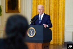 President Joe Biden listens to a question from a reporter while speaking about the Russian invasion of Ukraine in the East Room of the White House, Feb. 24, 2022.