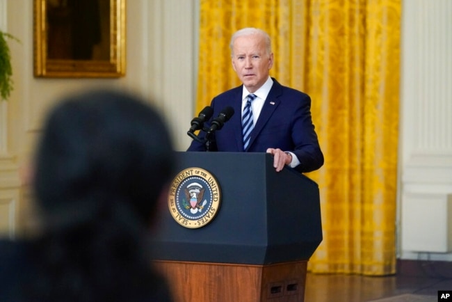 President Joe Biden listens to a question from a reporter while speaking about the Russian invasion of Ukraine in the East Room of the White House, Feb. 24, 2022.
