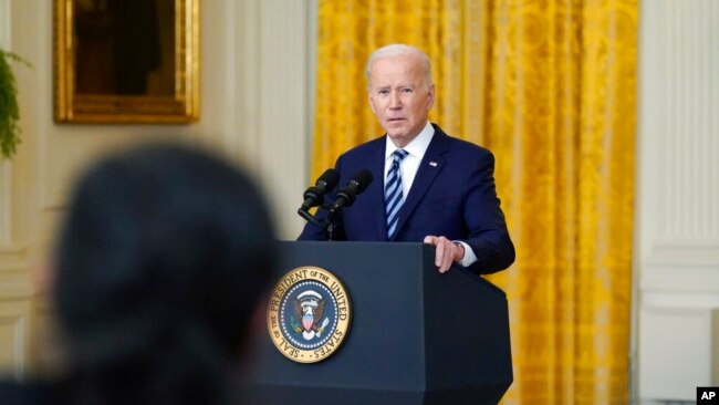 President Joe Biden listens to a question from a reporter while speaking about the Russian invasion of Ukraine in the East Room of the White House, Feb. 24, 2022.