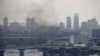 Smoke rises from the territory of the Ukrainian Defense Ministry's unit, after Russian President Vladimir Putin authorized a military operation in eastern Ukraine, in Kyiv, Feb. 24, 2022. 