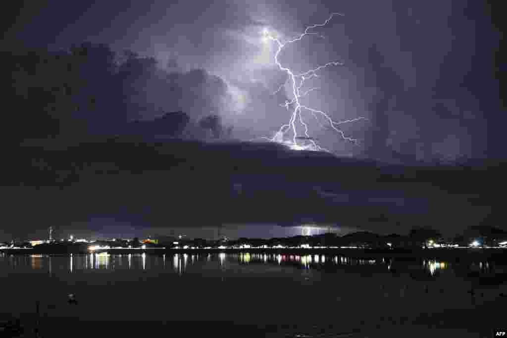 Lightning strikes over the city of Lhokseumawe, Aceh, Indonesia.