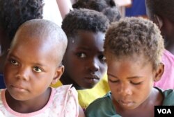 UNICEF says it is considering providing temporary learning shelters to students like these in evacuation camps. (Lameck Masina/VOA)