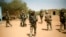 FILE - French soldiers secure the area at the entrance of Gao, northern Mali, on Feb. 10, 2013.