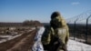 Ukrainian frontier guards patrol an area along the Ukrainian-Russian border in the Kharkiv region, Ukraine on Feb. 23, 2022.