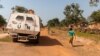 FILE - A United Nations armored personnel carrier patrols on a supposedly safe road, avoiding roads with possible explosive devices, in Paoua, Central African Republic, Dec. 5, 2021.