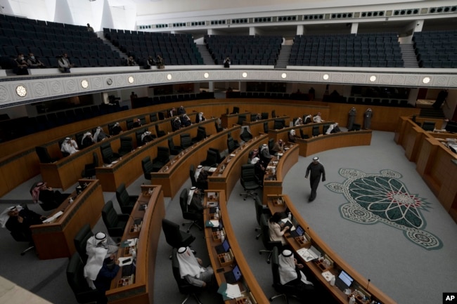 Lawmakers attend a session of Kuwait's National Assembly, in Kuwait City, Tuesday, Feb. 8, 2022. (AP Photo/Maya Alleruzzo)