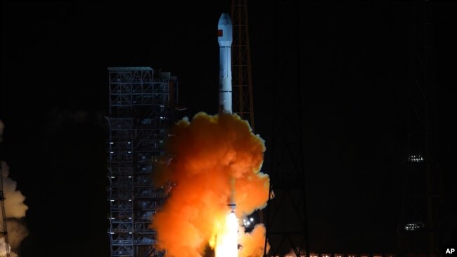 In this photo released by China's Xinhua News Agency, the the unmanned Chang’e 5-T1 spacecraft is launched atop an advanced Long March 3C rocket from the Xichang Satellite Launch Center in southwest China's Sichuan Province, Friday, Oct. 24, 2014. (AP Pho