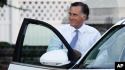 FILE - Mitt Romney leaves a meeting with President-elect Donald Trump at Trump National Golf Club in Bedminster, N.J., Nov. 19, 2016.
