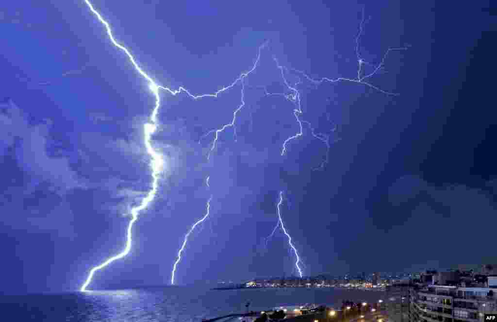 Lightning strikes during a thunderstorm in Montevideo, Uruguay, Feb. 20, 2022.