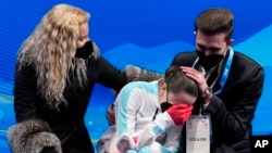 Kamila Valieva of the Russian Olympic Committee reacts after competing in the women's free skate program during the figure skating competition at the 2022 Winter Olympics, Feb. 17, 2022, in Beijing.