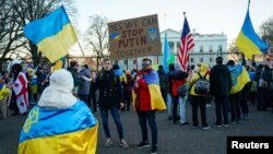 Demonstrators participate in the 'Stand with Ukraine' rally in Lafayette Square near the White House in Washington, U.S., Feb. 20, 2022. 