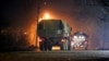 Military trucks move down a street outside Donetsk, the territory controlled by pro-Russian militants, eastern Ukraine, Feb. 22, 2022.