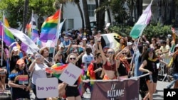 FILE - Participants with the Alliance for LGBTQ Youth march at the annual Miami Beach Gay Pride Parade, April 9, 2017, in Miami Beach, Florida.