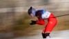 Dinigeer Yilamujiang of China competes during the women's sprint free cross-country skiing competition at the 2022 Winter Olympics, Feb. 8, 2022, in Zhangjiakou, China.
