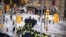 Police gather near the site of a trucker blockade in Ottawa, Feb. 18, 2022. Police began arresting protesters and towing away trucks Friday in a bid to break the three-week siege of Canada's capital by hundreds of truckers angry about the country's COVID-19 restrictions.