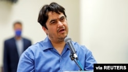 Ruhollah Zam, a dissident journalist who was captured in what Tehran calls an intelligence operation, speaks during his trial in Tehran, Iran, June 2, 2020. 