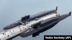 FILE - In this photo, Russian nuclear submarines are harbored at a Russian naval base in Gazhiyevo, Kola Peninsula, Russia, on April 13, 2021.