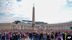Faithful gathered in St. Peter's Square at The Vatican listen to Pope Francis, Feb. 13, 2022, during the traditional Sunday's Angelus prayer.