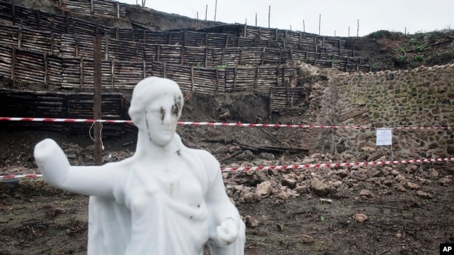 Parts of a wall surrounding an ancient house in Pompeii collapsed after days of heavy rain is roped off in Pompeii, Italy, Tuesday, Nov. 30, 2010. (AP Photo/Salvatore Laporta)