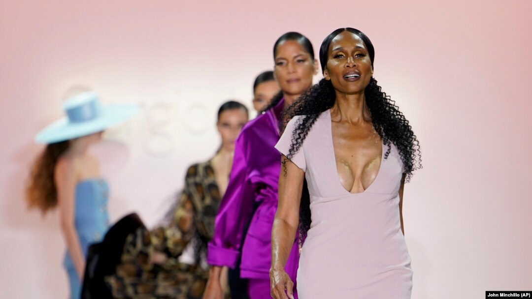 Fashion from Sergio Hudson's fall/winter 2022 collection is modeled by Beverly Johnson, front, during Fashion Week, Sunday, Feb. 13, 2022, in New York. (AP Photo/John Minchillo)
