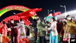 North Korean youth and students take part in an evening gala to celebrate the Day of Shining Star at Kim Il Sung Square in Pyongyang, North Korea, on the occasion of the 80th birth anniversary of the country's late leader Kim Jong Il, Feb. 16, 2022.