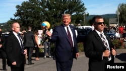 U.S. President Donald Trump is seen outside Arcaro and Genell restaurant, after attending a campaign event at Mariotti Building Products in Old Forge, Pa., Aug. 20, 2020. 