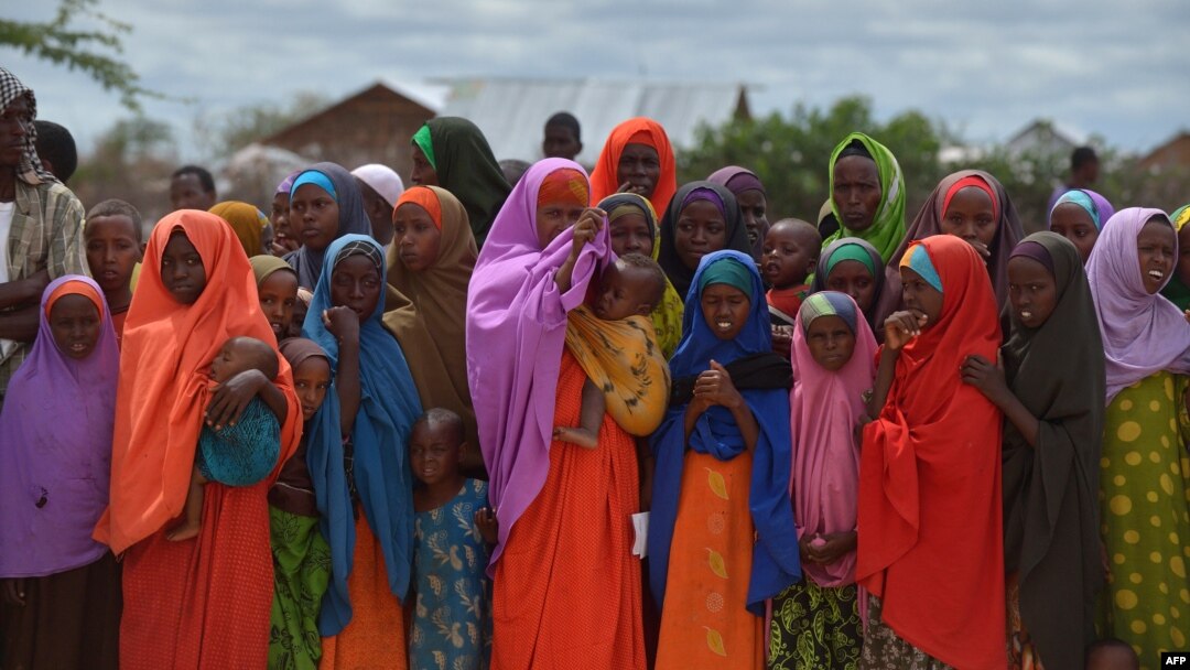FILE - Refugees gather to watch the arrival of United Nations High Commissioner for Refugees Antonio Guterres at IFO-2 complex of the sprawling Dadaab refugee camp, May 8, 2015.