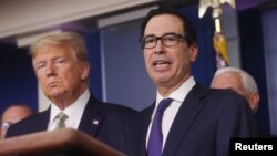 U.S. President Donald Trump and Treasury Secretary Steven Mnuchin answer questions during the Trump administration?s daily coronavirus briefing at the White House in Washington, U.S., March 17, 2020. REUTERS/Jonathan Ernst