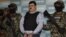 Mexican Navy marines flank Jorge Eduardo Costilla Sanchez in Mexico City, Sept. 13, 2012.