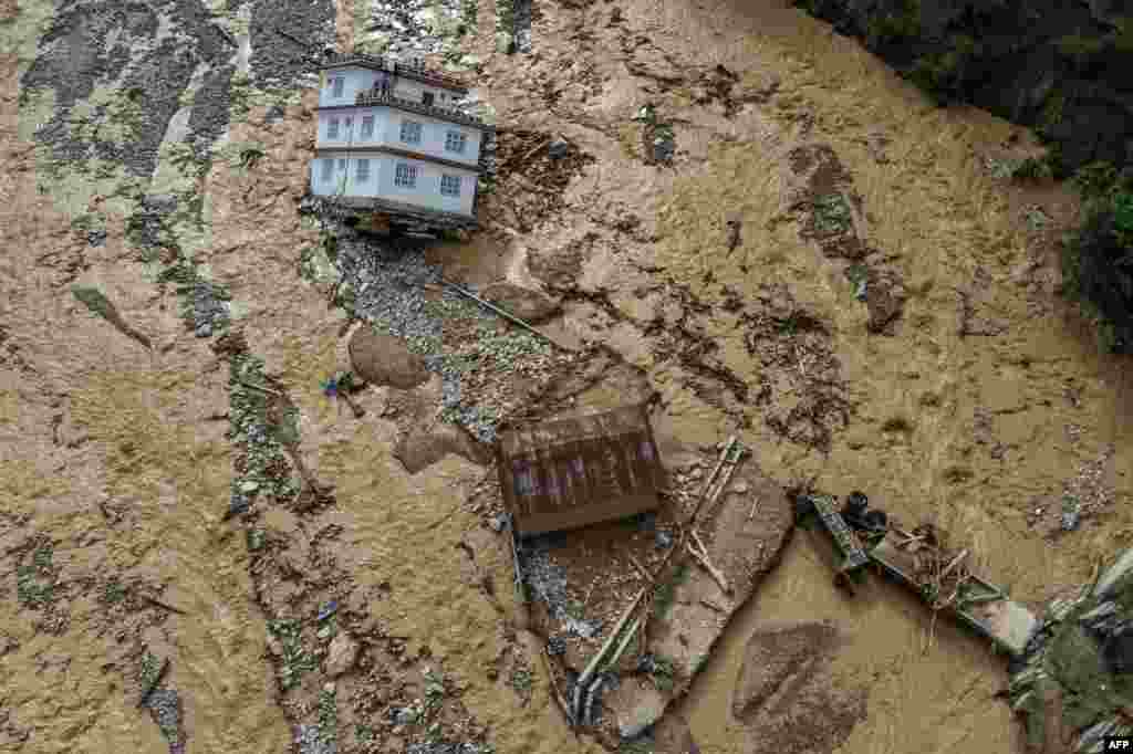 An aerial view shows the area affected by monsoon flooding in Roshi village of Nepal&#39;s Kavre district.&nbsp;Search and rescue teams in the country&#39;s capital picked through wrecked homes after waters receded from monsoon floods that killed at least 209 people around the Himalayan republic.