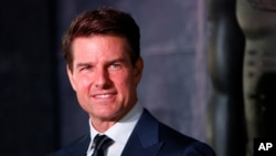 FILE - Actor Tom Cruise poses while promoting a film in Mexico City, June 5, 2017.