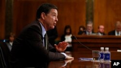 FILE - FBI Director James Comey testifies on Capitol Hill in Washington, May 3, 2017.