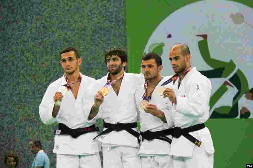 A displaced man sits on the ruins of a destroyed building outside Hammam al-Alil camp, south of Mosul, Iraq.