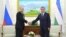 Uzbekistan's Prime Minister Shavkat Mirziyayev, right, poses for a photo with Russian President Vladimir Putin in Samarkand, Uzbekistan, Sept. 6, 2016. Putin came to offer condolences and visit the grave of Uzbekistan's late president, Islam Karimov.