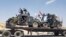 A handout picture released by the Iraqi Federal Police on Aug. 15, 2017, shows Iraqi armored units headed for the town of Tal Afar, the main remaining Islamic State stronghold in the northern part of the country. Iraqi warplanes carried out airstrikes against IS group positions in Tal Afar in preparation for a ground assault.