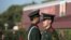 Chinese paramilitary policemen stand guard near Tiananmen Gate in Beijing, November 1, 2012.