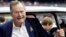 FILE - Former President George H.W. Bush pauses for a photo.